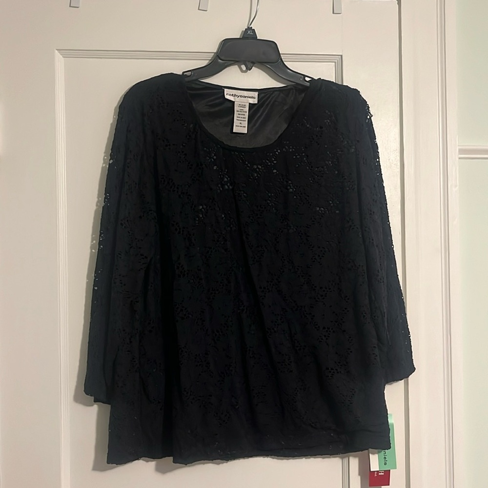 Lace top, 2nd layer on torso area. Sleeves lace only. Stretchy material